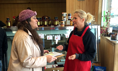 Diana McKeown with Metro CERT talks to a Chisago business owner about energy efficiency