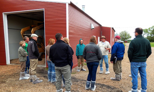 Touring the biomass-heated poultry barn at Viking Company
