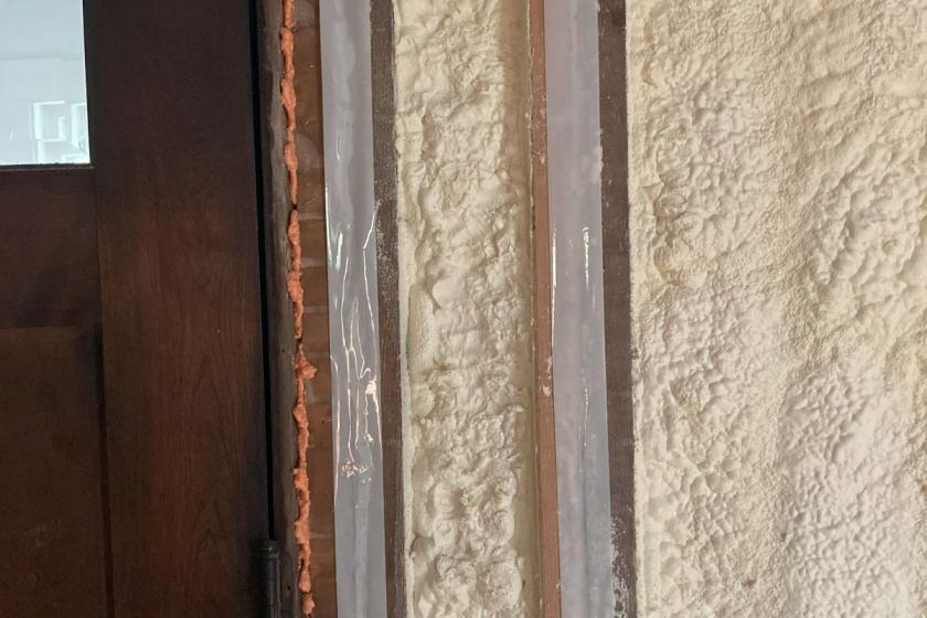 An example of caulking and tape and more spray foam used to air seal.