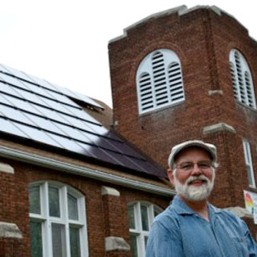Tim Johnson, pastor of Cherokee Park United Church in St. Paul, says visitors frequently inquire about the church’s solar array. (Photo by Ken Paulman / Midwest Energy News)