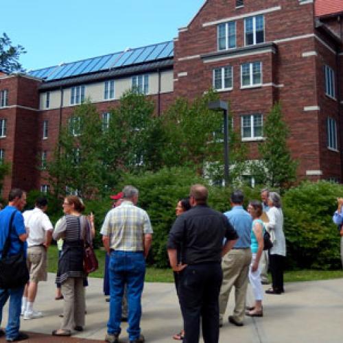 Touring solar installations at Carleton College before learning about community solar opportunities