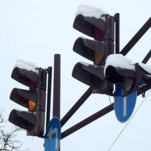 Snow sits on traffic lights in the winter