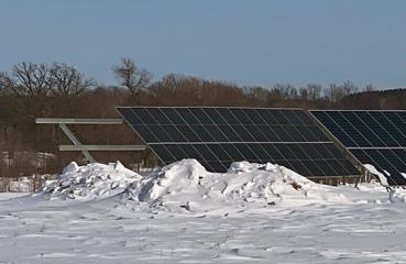 Solar array surrounded by snow
