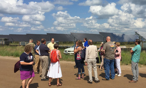 Attendees learn about 10MW solar PV array under construction at Camp Ripley