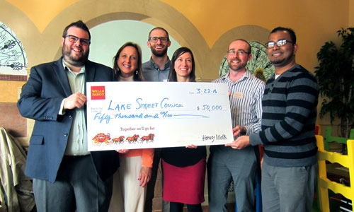 Lake Street Council accepts check for Energy Coaching project