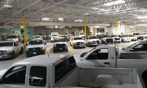 Vehicle garage space with passive solar heating and LED lighting