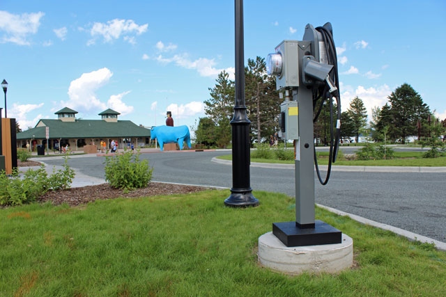 Mathews and Albrecht visit the electric vehicle charging station at Bemidji City Hall