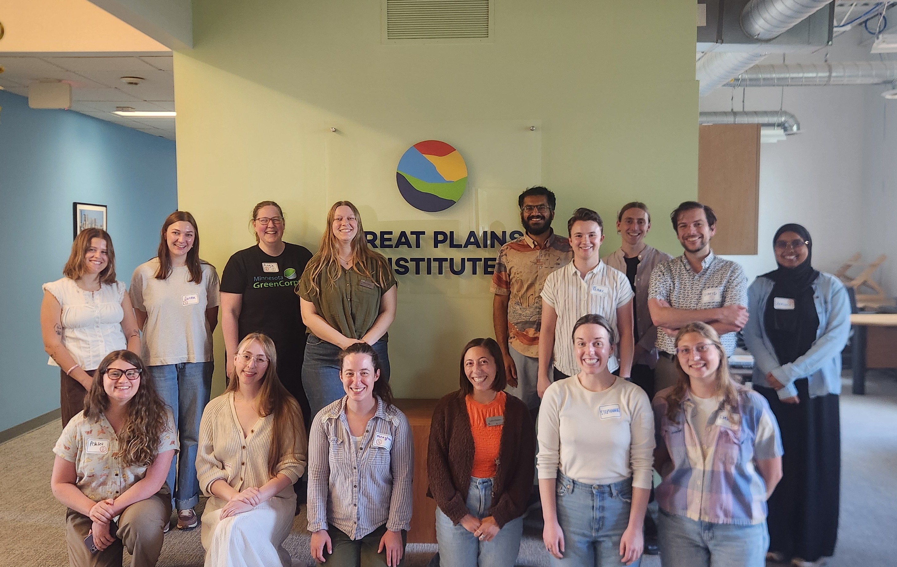 Group photo of the cohort in front of the Great Plains Institute sign