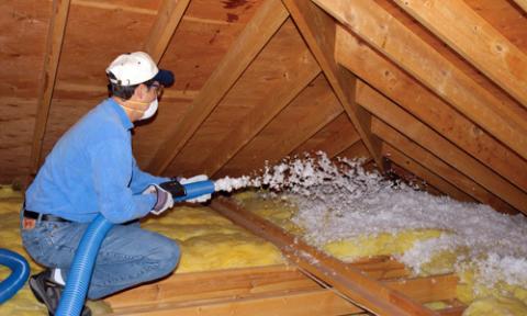 Blowing cellulose insulation into an attic after air sealing