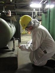 A MnTAP intern works at Kemps Ice Cream