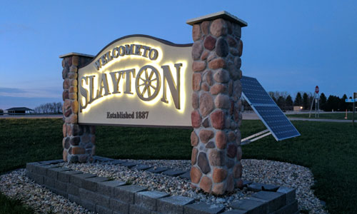 New solar-powered LED lit signs welcome people to Slayton