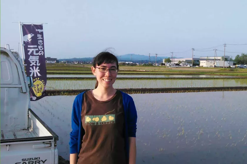 Karen in front of a rice field