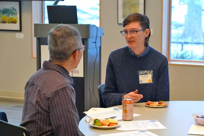 People talking during the event at a table