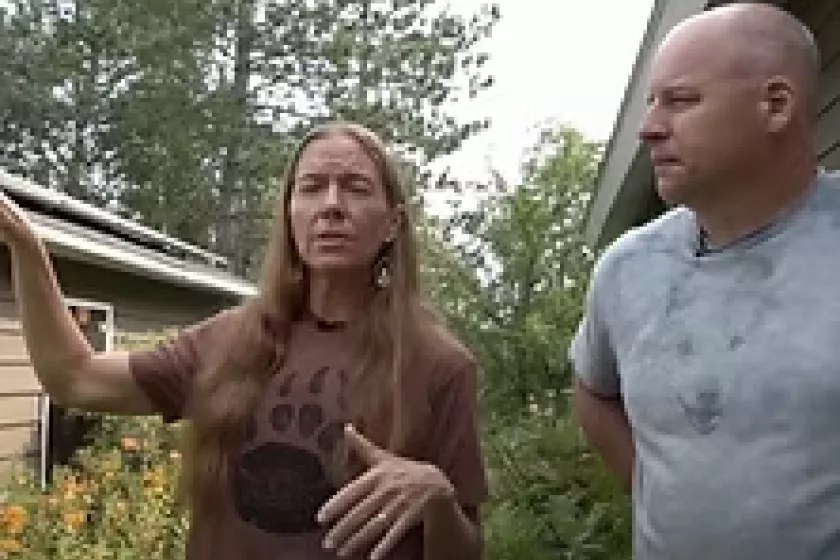Woman and man outside explaining