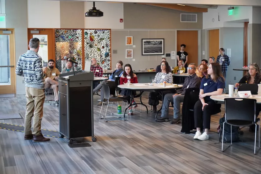 David speaking to a crowd of listeners