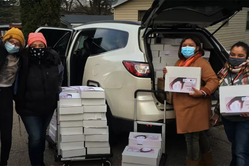 People holding energy saving kits