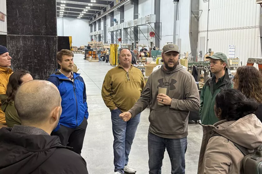 People gathered inside an energy facility