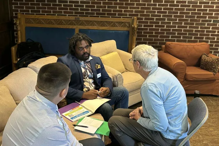 Community members discussing resilience hubs during the Community of Practice gathering.