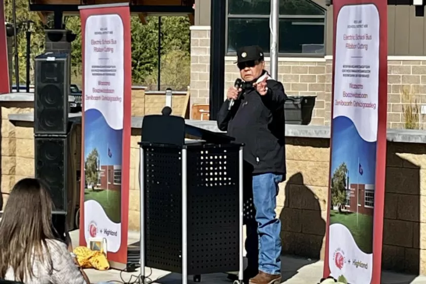 Man speaking behind a podium