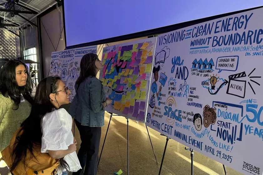 Attendees viewing the illustrations