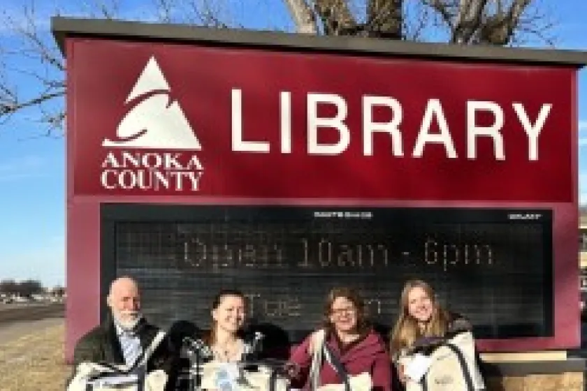 Posing in front of Anoka Library with induction cooking kit