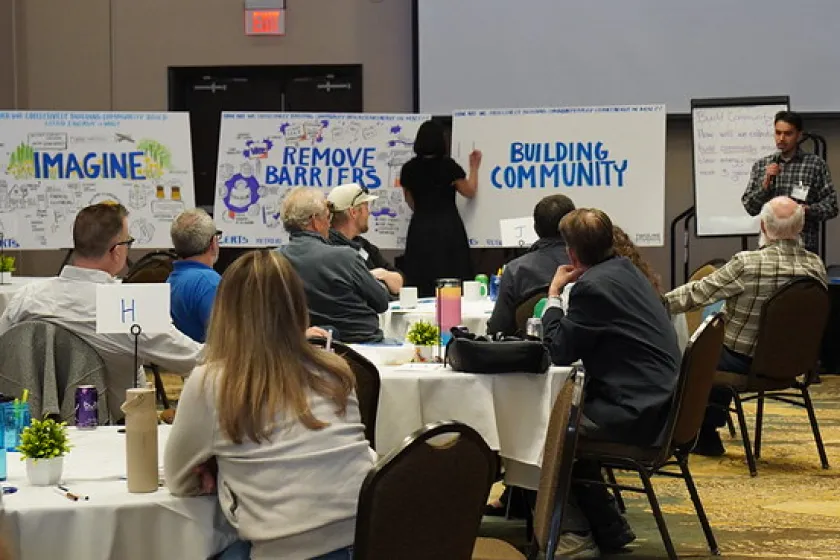 People gathered at tables in a large room