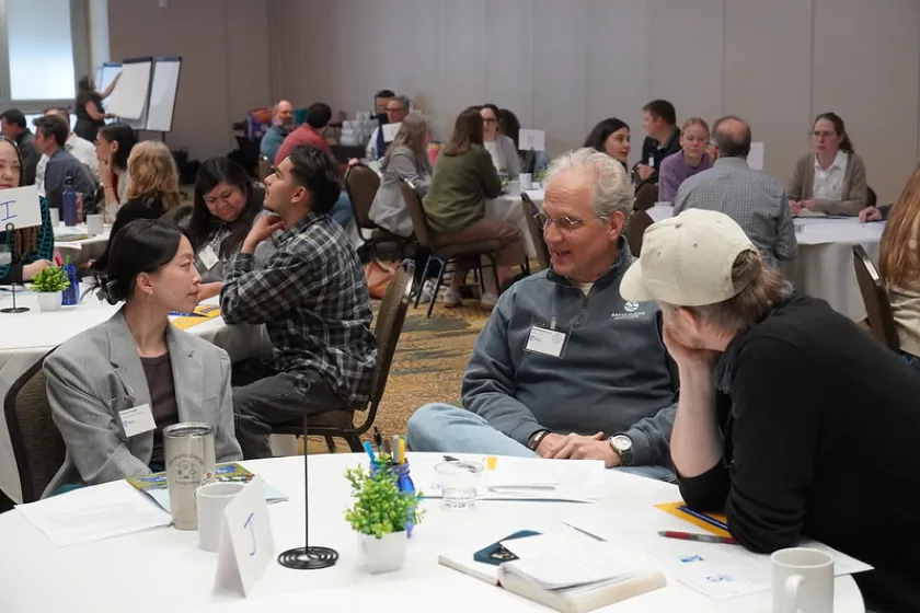 People gathered at tables in a large room
