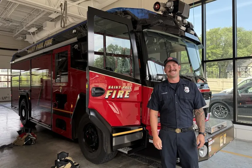 Sullivan standing in front of the truck