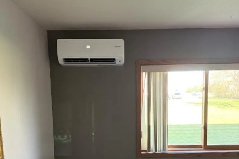 HVAC system inside the apartment, over the window