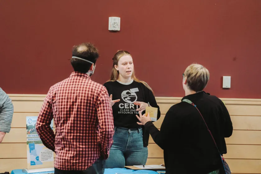 Olivia talking with attendees