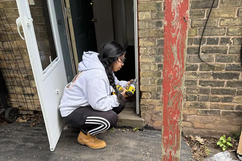 Boreal Worker repairing a door frame
