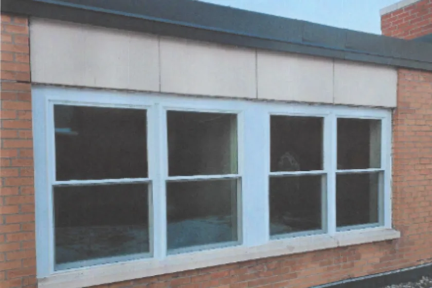Up close picture of building window from outside