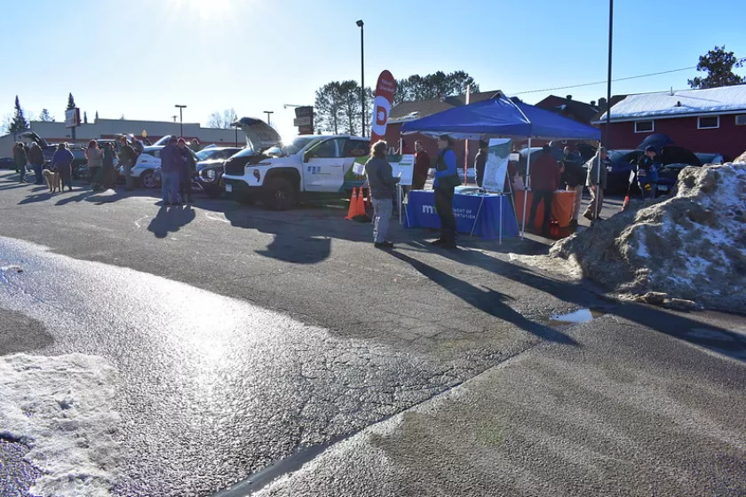 People looking at electric vehicles