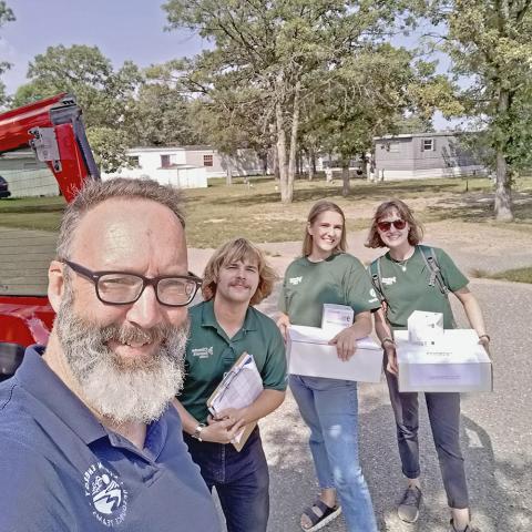 CERTs staff with boxes at Bemidji event