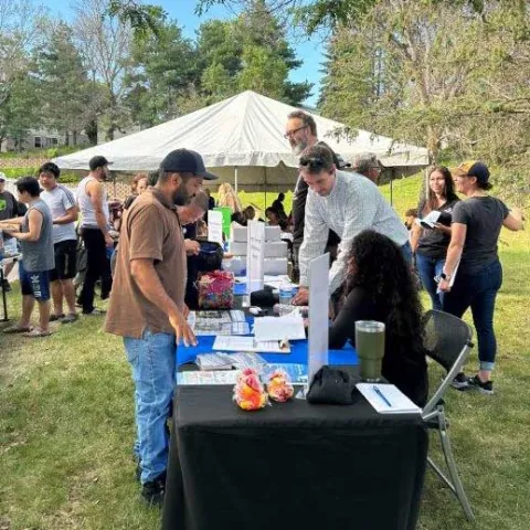 Handing out energy efficiency items at Rambush manufactured home park