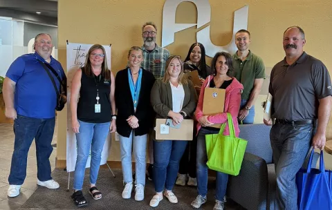 The CERTs crew and Austin Utility employees gather to reach out to local businesses in Austin. 