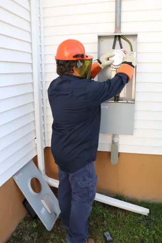 Technician repairing a meter