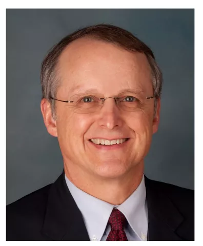 Headshot of Alan Anderson, he is a white male wearing glasses.