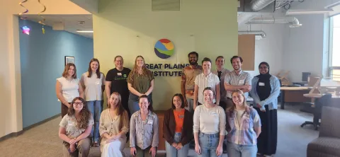 Cohort in front of the Great Plains Institute logo 