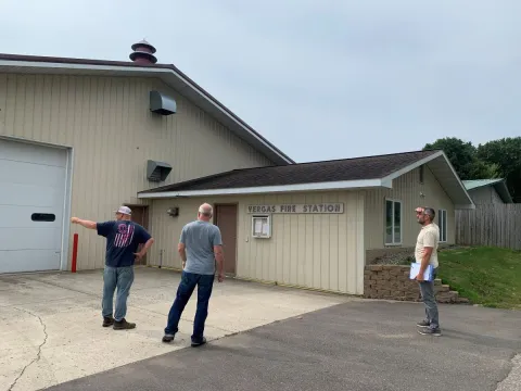 people in front of vergas fire station