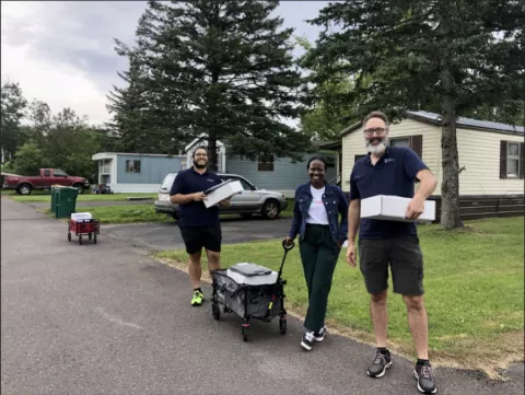 CERTs’ Joel Haskard(right) visits Sunnyside Estates in Cloquet for a clean energy “blast” outreach event. Joined by CERTs’ Cinderella Ndlovu (middle) and Center for Energy and Environment’s Gerardo Roca(left).