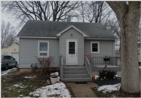 Picture of a grey single story home 