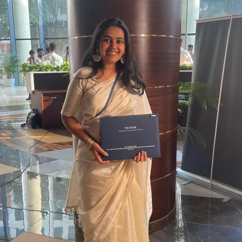 Salunke a few years ago in India, holding her graduate diploma.