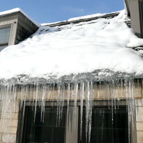 Ice dam on a home in winter