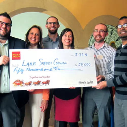 Lake Street Council accepts check for Energy Coaching project