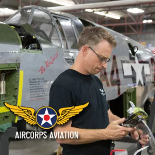 Working on a plane in the newly insulated AirCorps Aviation shop