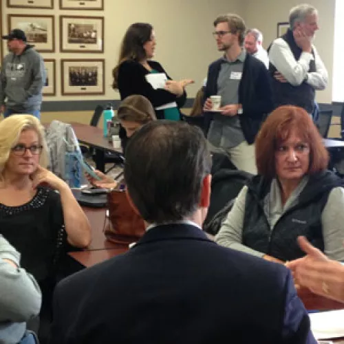 Attendees chatting about super exciting energy efficiency opportunities, all made possible by building benchmarking!