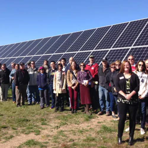Tour participants gathered for a big group photo in front of Detroit Lake’s Community Solar Garden