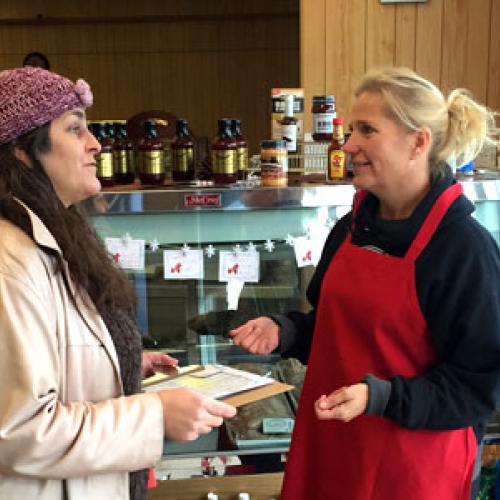 Diana McKeown with Metro CERT talks to a Chisago business owner about energy efficiency