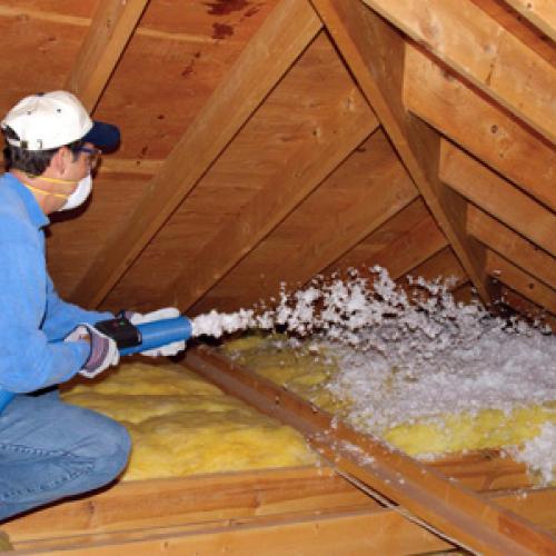 Blowing cellulose insulation into an attic after air sealing